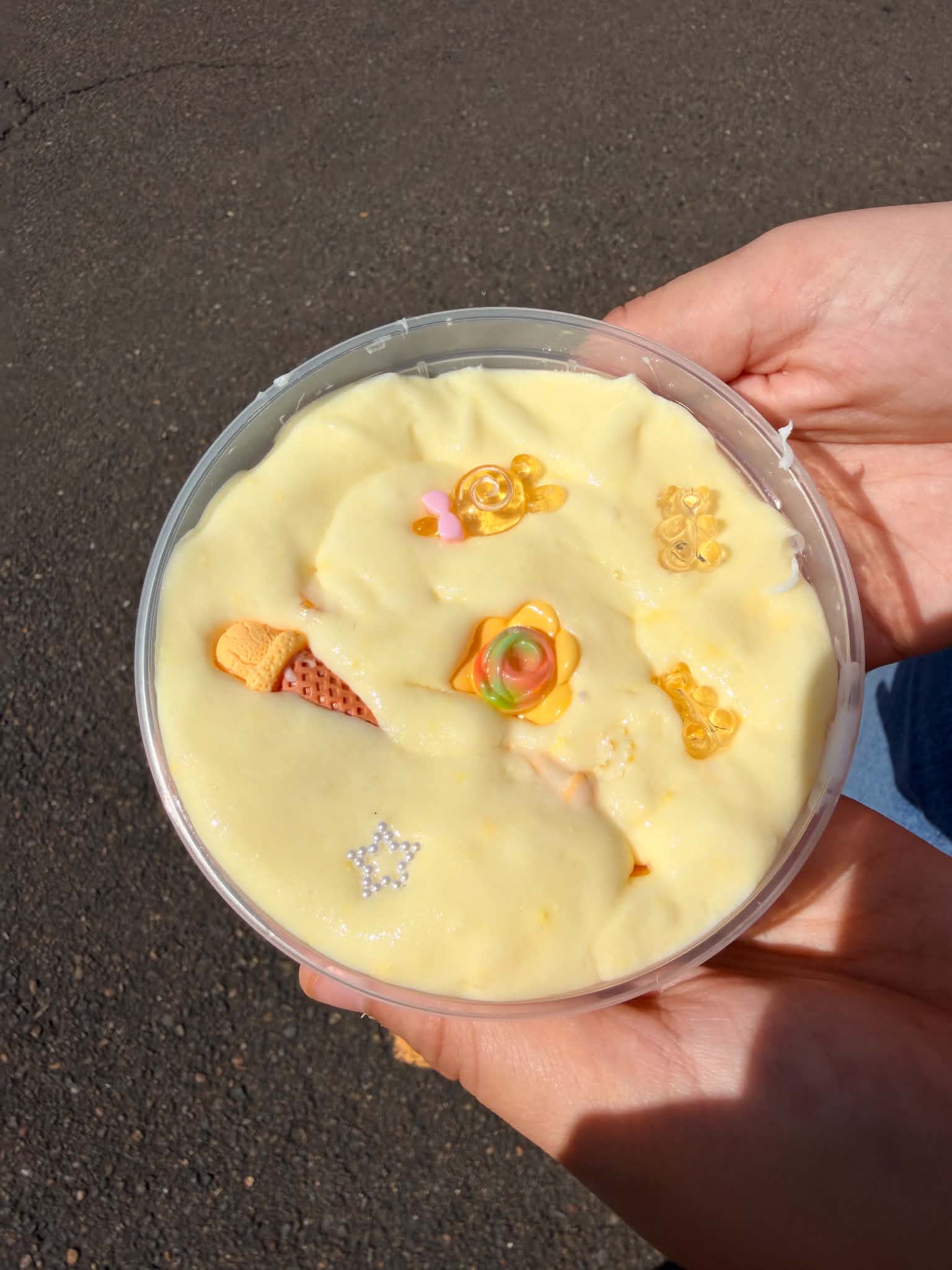 Soft yellow Butter slime decorated with colorful charms